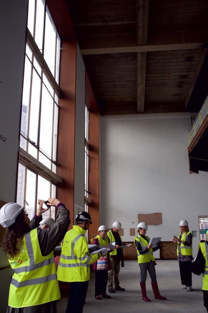 Photo of a triple-height foyer with large floor-to-ceiling windows