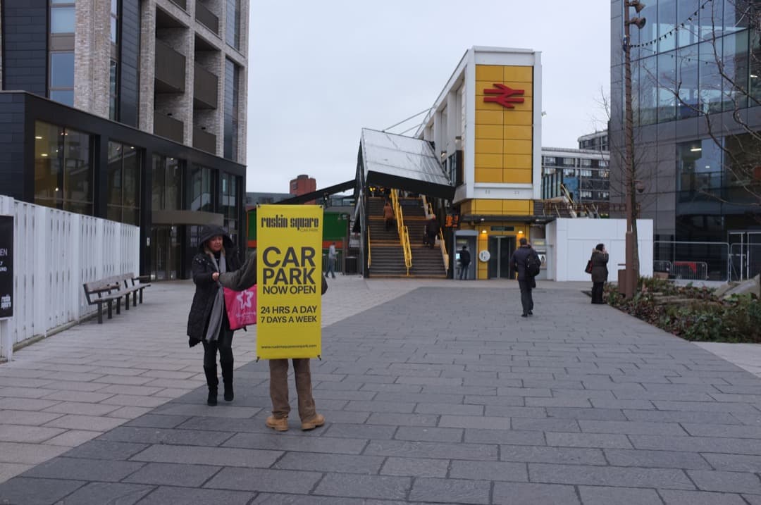 Photo of a man handing out leaflets